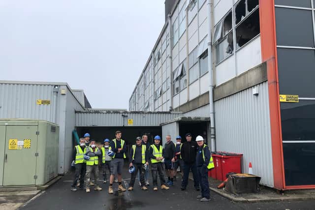 Workers begin the salvage operation