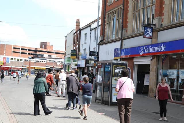 Queues in Kettering town centre this morning.