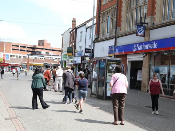 Queues in Kettering town centre this morning.