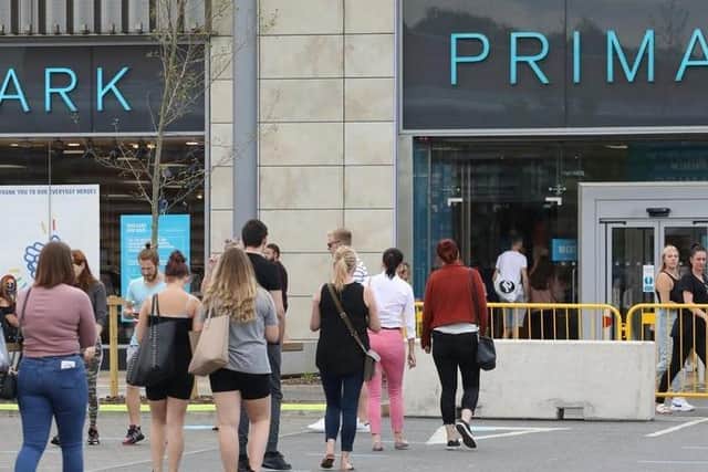 Shoppers queuing to get into Primark at Rushden Lakes on June 15