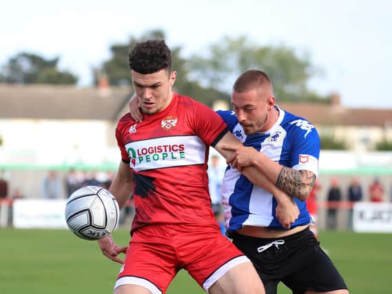Poppies defender Connor Barrett holds off a Chester opponent