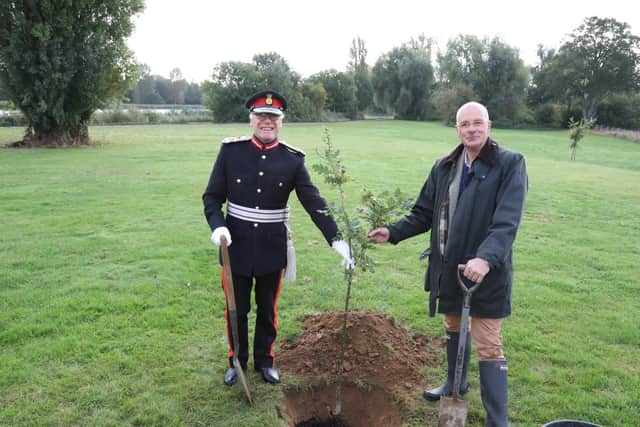 James Saunders Watson and Oliver Wicksteed with the oak sapling grown from an acorn from the 300 year old tree