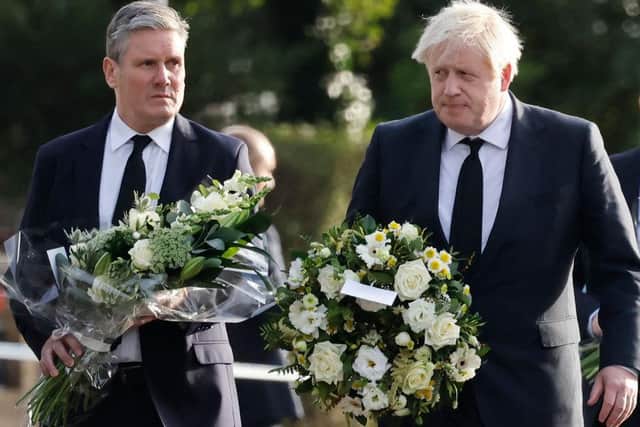 Party leaders Sir Keir Starmer and Boris Johnson today laid tributes together at the murder scene
