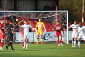 Referee Dean Watson points to the spot to award Buxton their last-gasp penalty as Kettering Town conceded late on in the 2-2 draw at Latimer Park. Pictures by Peter Short