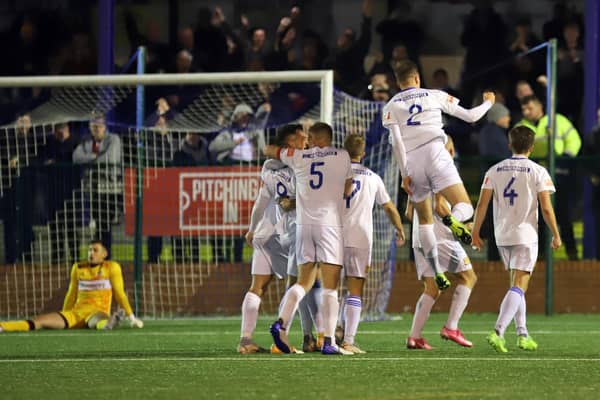 The Buxton players celebrate one of their goals as they beat Kettering Town 3-1 after extra-time in the FA Cup fourth qualifying round replay. Pictures by Peter Short