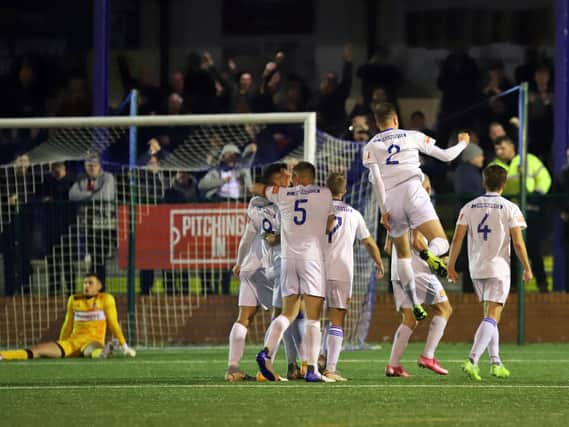 The Buxton players celebrate one of their goals as they beat Kettering Town 3-1 after extra-time in the FA Cup fourth qualifying round replay. Pictures by Peter Short