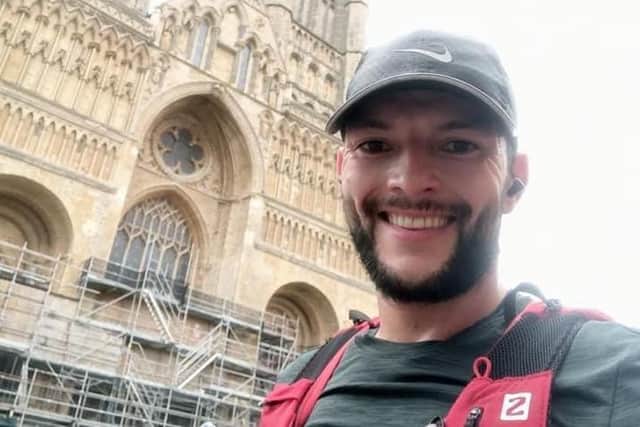 Jimmy running past Lincoln Cathedral on his month-long challenge