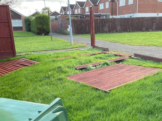 A blown-over fence and wheelie bin in Wellingborough