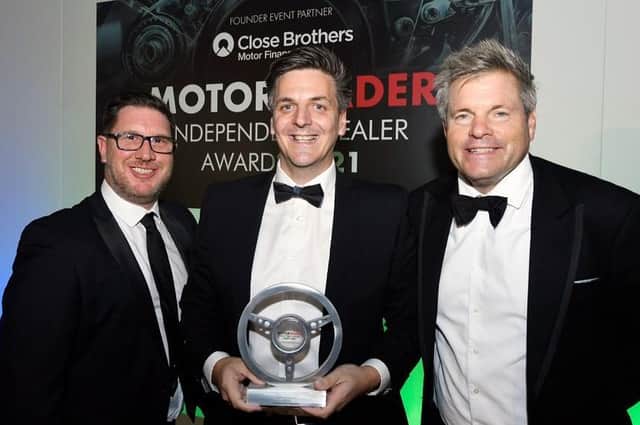 AutoProtect southern zone director Adam Head with Croyland Car Megastore General Manager Mark Swindells (pictured centre) being presented with one of three Motor Trader Independent Dealer Awards at the ceremony with celebrity host Mark Durden-Smith, pictured right.