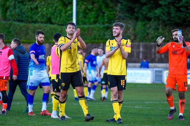 Alex Collard and Will Jones applaud the travelling fans after AFC Rushden & Diamonds' FA Trophy defeat at Matlock Town last weekend. Pictures courtesy of Hawkins Images