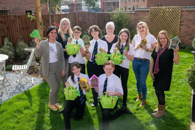 Students Dylan, George, Mya, Tayla and Oliver alongside Rushden Academy staff Dee Conway and Lesley Yeoman and Davidsons Homes Sales Manager Victoria Barnaby