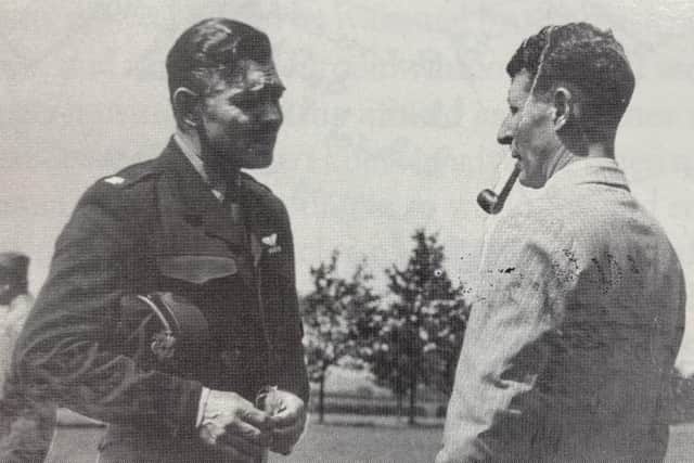 Captain Clark Gable chats with Oundle school-master Frank Spragg on the
Oundle school playing fields