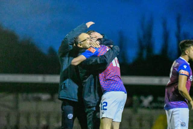 Andy Peaks shows his delight as he embraces matchwinner Will Jones after AFC Rushden & Diamonds' incredible 3-2 victory at Hednesford Town on Saturday. Picture courtesy of Hawkins Images