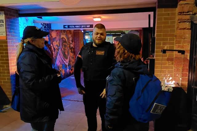 Emma-jane and June chat to door staff outside Mental Monkey.