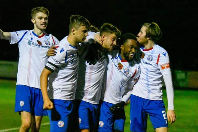 Ty Deacon takes the congratulations after he scored his first goal for Diamonds to bring them level against Kettering
