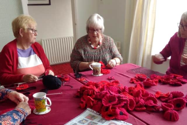 Irchester volunteers making poppies.