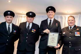 The Mounts Red Watch collect their award from Darren Dovey (right)