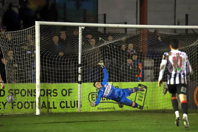 Rhys Davies is beaten by Connor Hall's penalty, which put Chorley 2-0 up