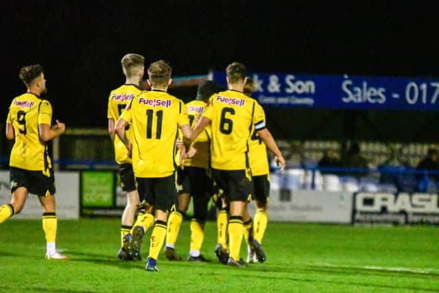 Nathan Tshikuna takes the congratulations after he scored AFC Rushden & Diamonds' equaliser in Tuesday's 2-1 loss at Leiston. Pictures courtesy of Hawkins Images