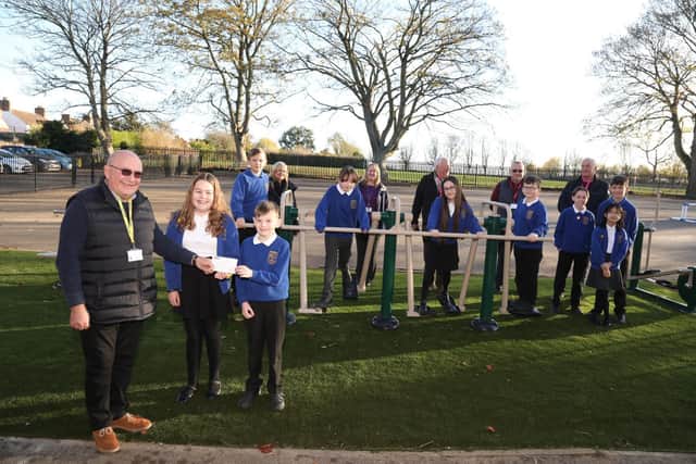 John Havlicek presents the cheque for the outdoor gym