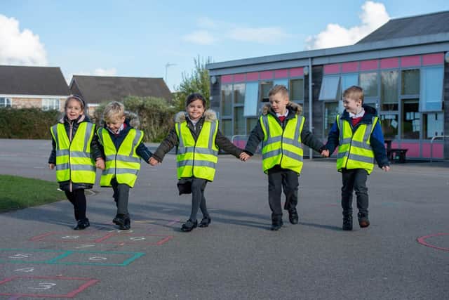 Oakley Vale Primary School pupils in their hi vis vests