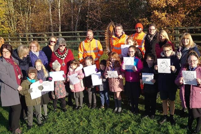 Mayor Cllr Tina Reavey with some of the pupils and their winning designs watched by representatives from National Highways, Ground Control and the local community