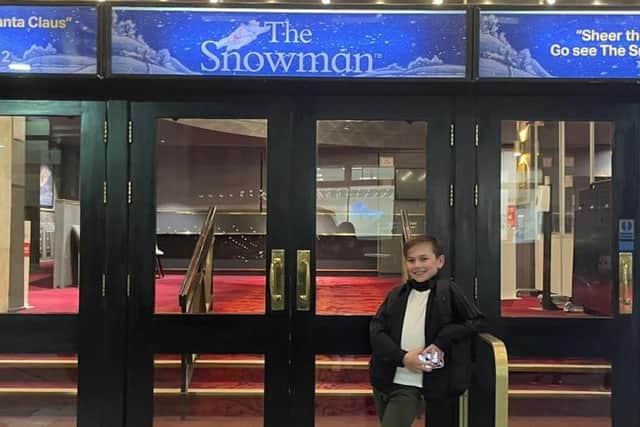 Jax on the steps of the theatre where he is performing
