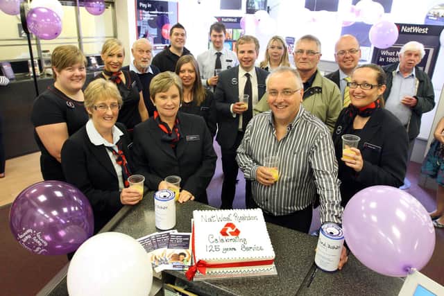 NatWest Anniversary :Rushden: 125th Anniversary of bank in the High St ...Staff celebrate the 125th anniversary with charity collection for Rushden MIND...Branch manager Lesley Duncan with current and past staff with Rob Aston (Rushden MIND) June 2013