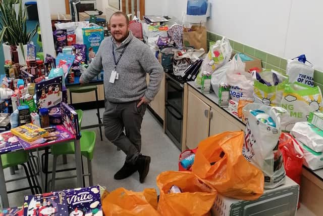 Hayden Wright with the donations.