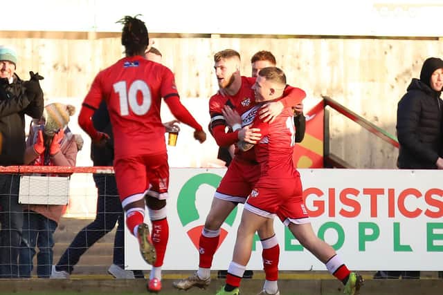 Jordon Crawford celebrates with Connor Kennedy after the latter had opened the scoring at the weekend before the former grabbed his first goal for Kettering Town to put them 2-0 up against Boston United. Pictures by Peter Short