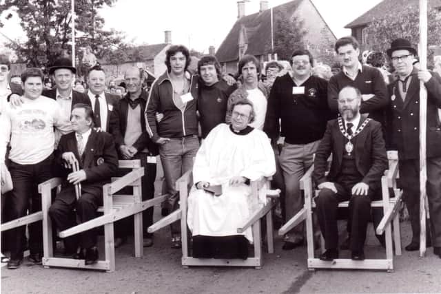 The priest in charge of St John's Church reads the charter at dawn after being carried through the streets on a chair 
1982