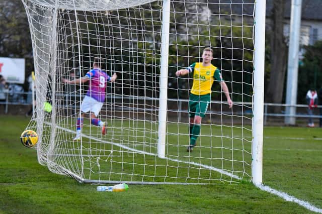 The ball is in the net and Ty Deacon heads off to celebrate after he scored AFC Rushden & Diamonds’ second goal in last weekend’s 2-1 win at Hitchin Town. Picture courtesy of Hawkins Images