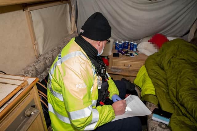 Officers found 17 employees of a business being housed in outhouses and caravans