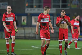 The Kettering Town players were left dejected after they let a 2-0 lead slip in their 2-2 draw at AFC Telford United. Picture by Peter Short