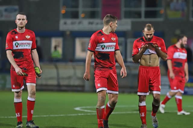 The Kettering Town players were left dejected after they let a 2-0 lead slip in their 2-2 draw at AFC Telford United. Picture by Peter Short