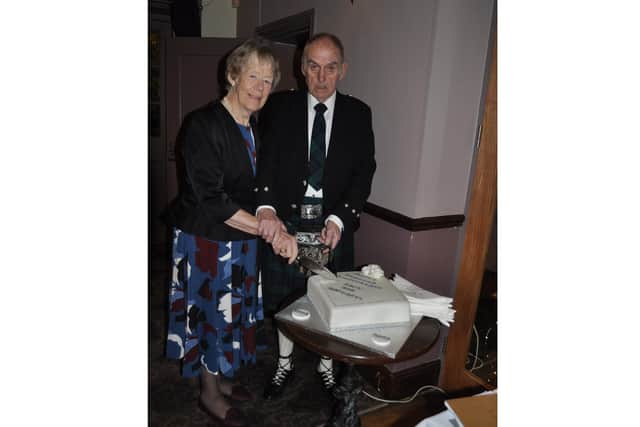 Margaret and Jack Kane cut the cake