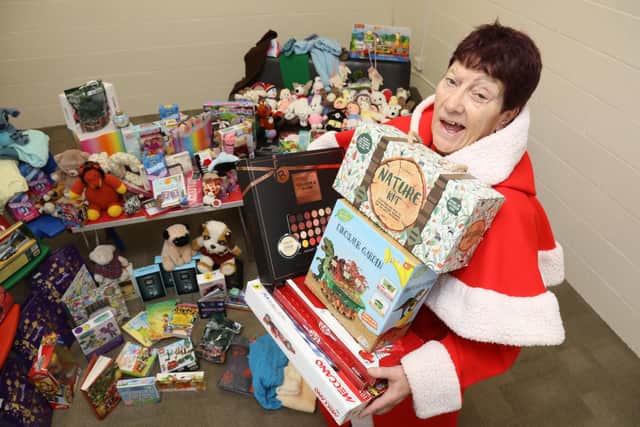 Jeanette Walsh aka Mother Christmas with just a fraction of the presents donated by generous readers