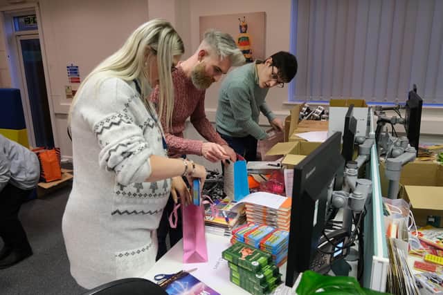 Staff sort the gift bags