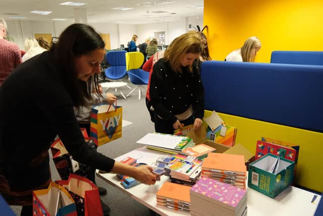 Staff sort the gift bags
