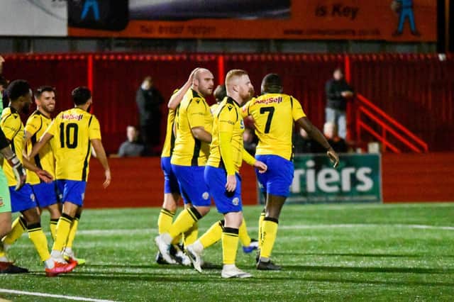 Liam Dolman takes the congratulations after his superb long-range strike, which proved to be enough to give AFC Rushden & Diamonds a 1-0 success at Tamworth. Picture courtesy of Hawkins Images