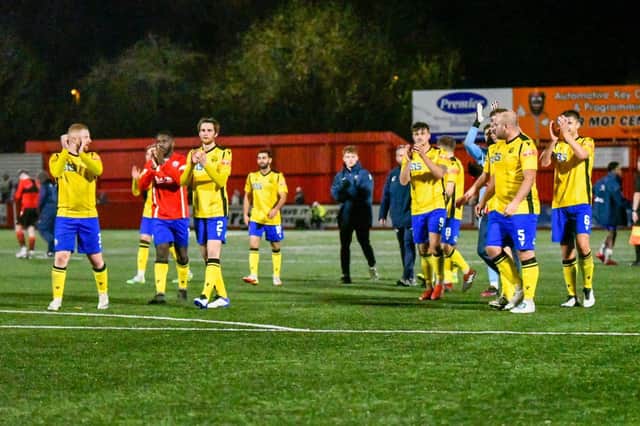 The AFC Rushden & Diamonds players applaud the travelling fans following their 1-0 win at Tamworth on Tuesday night. Picture courtesy of Hawkins Images