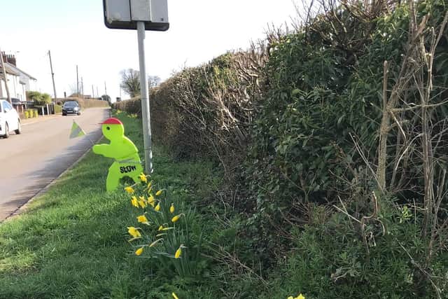 One of the green men, pictured before it was stolen.