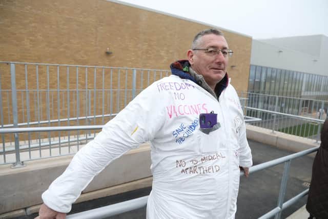 This man wore a boiler suit daubed with anti-Covid slogans