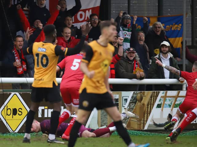 Jordon Crawford heads off to celebrate after he put Kettering Town ahead in their 4-0 success at Leamington. Pictures by Peter Short