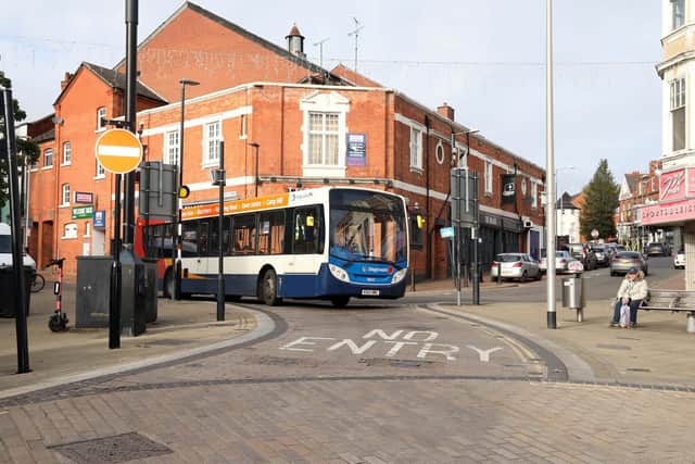 A bus passes through the bus gate - the ANPR camera is mounted on the building opposite