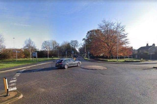 The mini-roundabout at the junction of Barton Road, Pytchley Road and London Road.