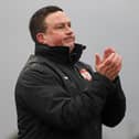 Kettering Town manager Paul Cox applauds his team from the sidelines during their fine 3-1 success over Brackley Town. Pictures by Peter Short