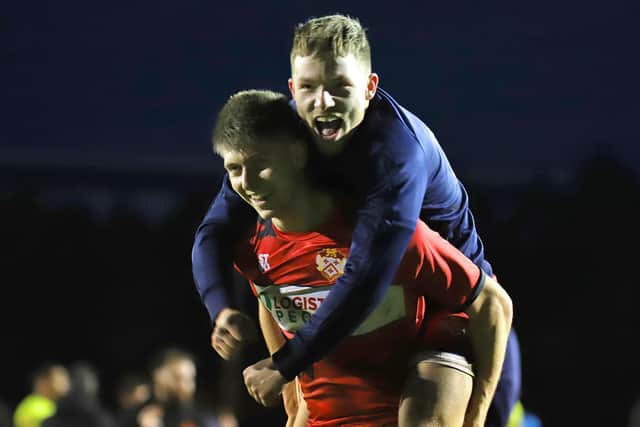 Connor Johnson and Jordon Crawford show their delight after the final whistle at Latimer Park
