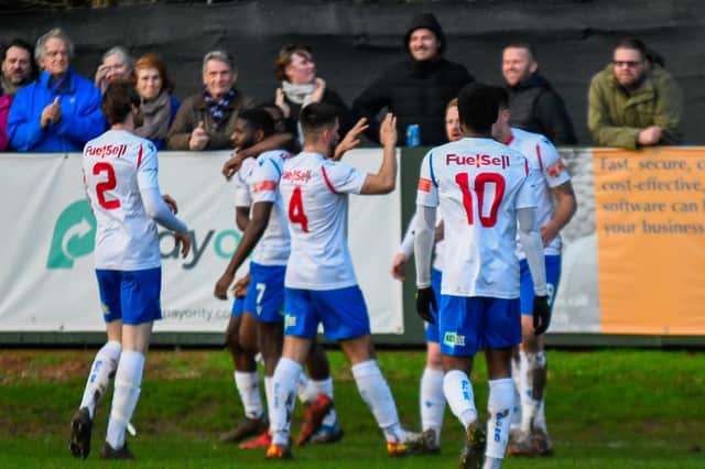 The AFC Rushden & Diamonds players celebrate their opening game in the 4-0 win over St Ives Town on New Year's Day. Picture courtesy of Hawkins Images