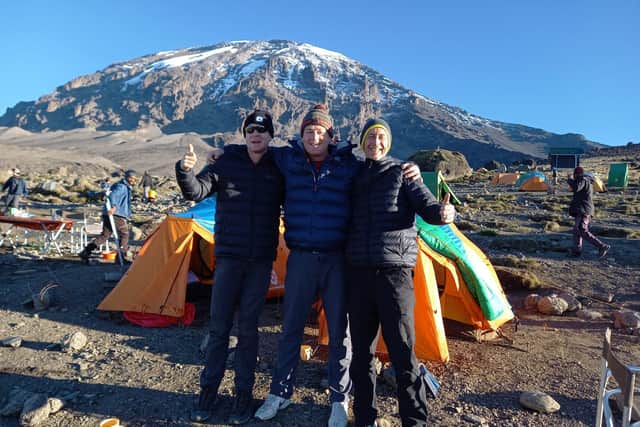 The Mills brothers with Kilimanjaro in the background